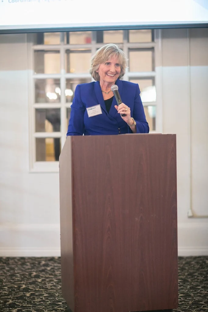 Nancy Wilson speaks to a crowd while she accepts her award.