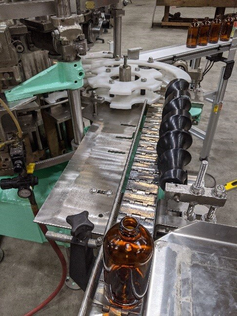 Photo of a automated piece of filling equipment.