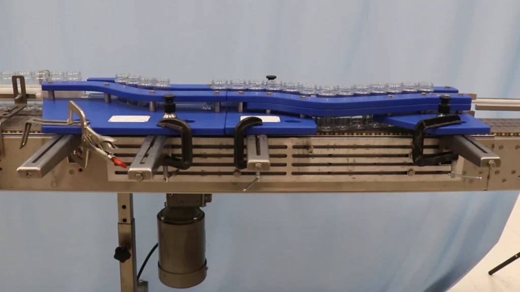 Versatile Container Handling System for Multi-Size Packaging Lines