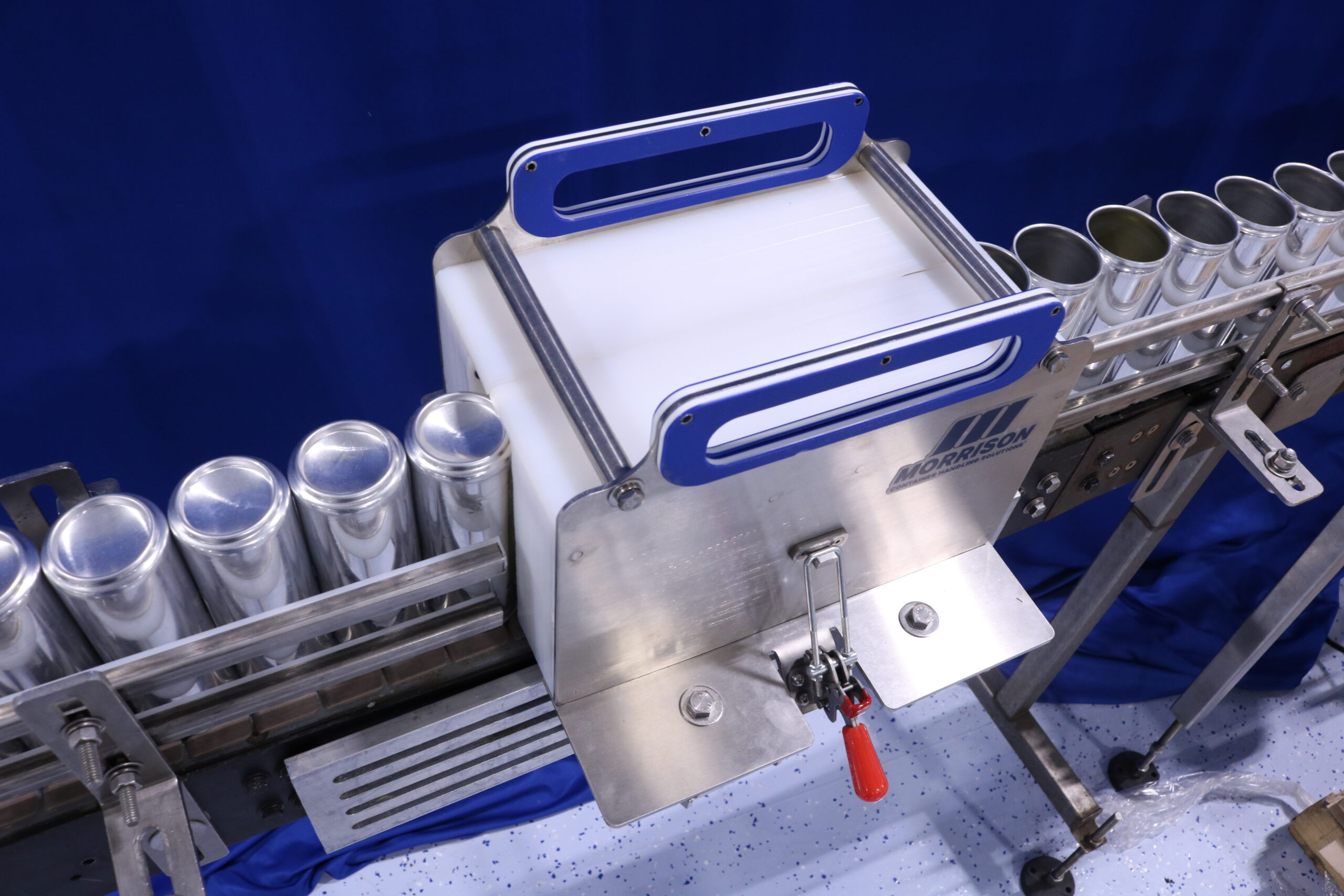 Cans being inverted by a twist block